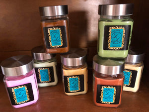 hand poured highly scented candles on a shelf. These candles are made by us at Double L Candles in Jacksboro Texas. They are pretty, and slow burning with an excellent scent throw to smell your home up nice!